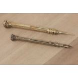 Two Victorian gilt metal propelling pencils,