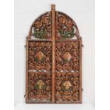 A pair of carved and pierced giltwood royal doors,