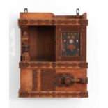 A chip-carved wooden wall-hanging cabinet,