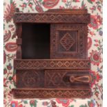 A chip-carved wooden wall-hanging cabinet,