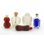 A collection of four Chinese Peking glass snuff bottles,