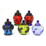 A collection of five Chinese overlay Peking glass jars and covers,