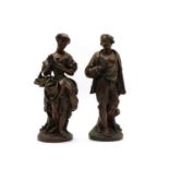 A pair of late 19th century French bronze figures of a lady and gallant,