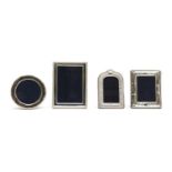 A set of four silver-mounted photo frames,