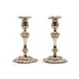 A pair of George III silver candlesticks,