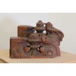 A pair of Indian carved teak corbels,