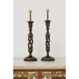 A pair of Indian papier mâché candlesticks,