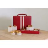 A red leather vanity case by Asprey London,