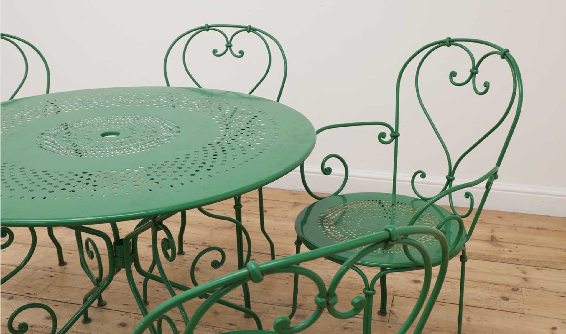 A green-painted aluminium garden table,