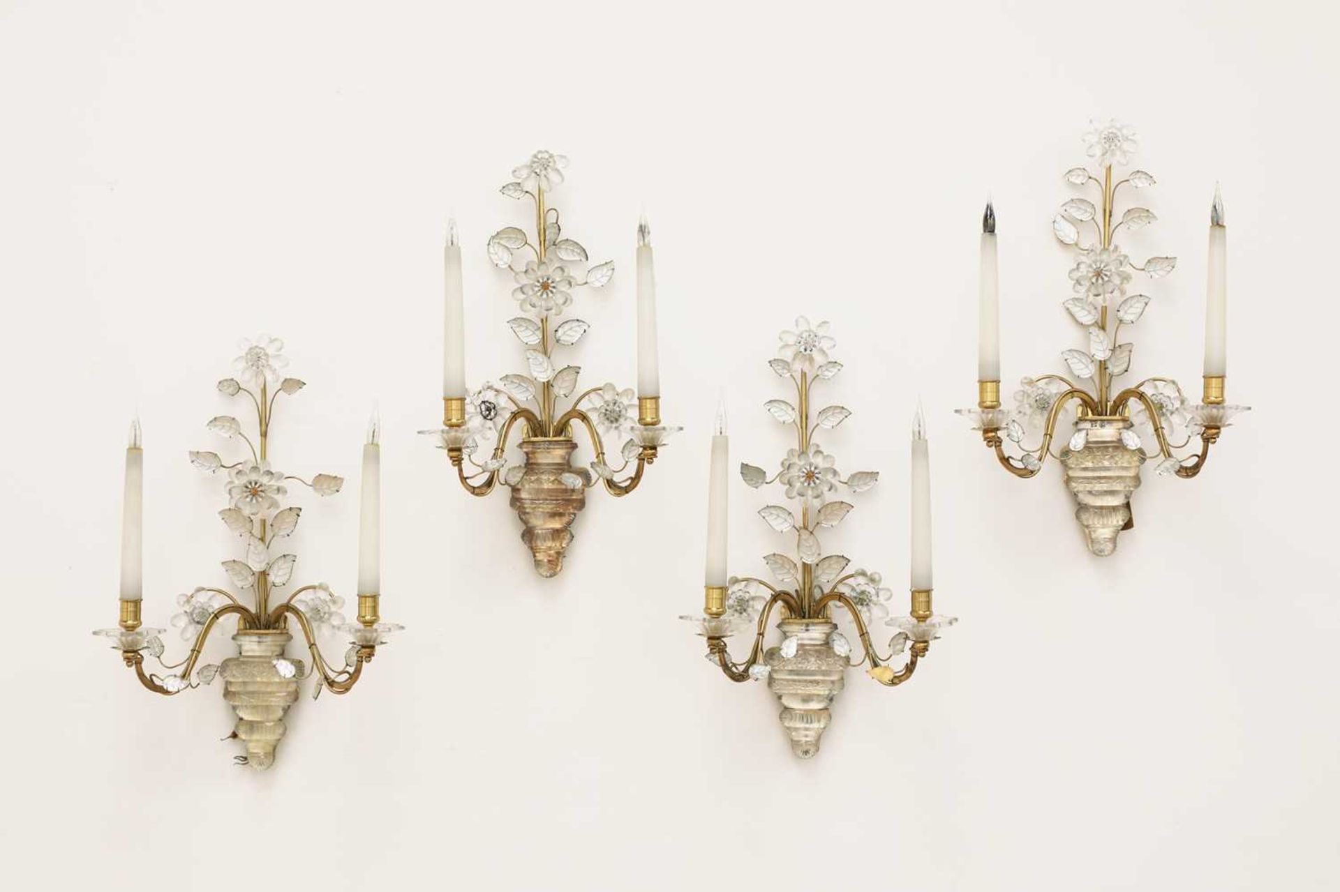 A set of four glass and gilt metal wall lights,