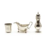 A George III style silver sauce boat, a sugar castor and a beaker