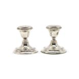 A pair of dwarf silver candlesticks,