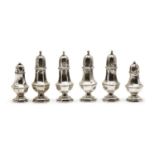 A set of four silver pepperettes,