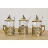 A set of three Russian silver gilt tea glass holders,