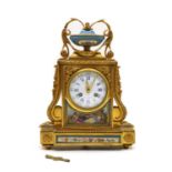 A Louis XVI style French gilt brass cased mantel clock,