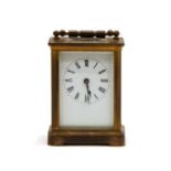 A French brass and carriage timepiece,