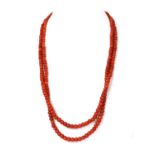 A two row graduated coral bead necklace,