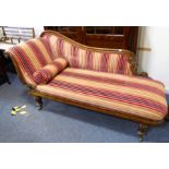 An ornate mid-19th century upholstered and mahogany-framed chaise longue; finely carved with various