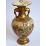A small circa 1900 Japanese two-handled vase; enamel and gilt decorated with a lady painting and