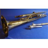 A brass Corton trumpet; serial number 668868, cased and with spare detachable mouthpiece