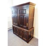 An antique oak press cupboard in two parts basically made from 18th century components; the outset