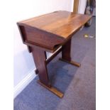 An early 20th century school desk with brass inkwell (66cm wide)