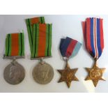 Four Second World War medals; two Defence Medals and two 1939-1945 Stars (The cost of UK postage via