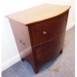 An early 19th century bow-fronted mahogany commode raised on French-style bracket feet (62cm wide)