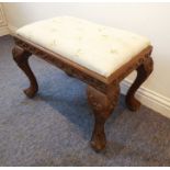 An early 20th century Anglo-Indian-style hardwood stool; the drop-in top above a frieze carved