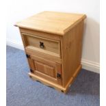 A modern pine bedside-style cabinet having single drawer and panelled door below (44cm wide)
