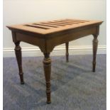 A late 19th century satinwood luggage rack on turned legs