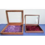 Two small wooden-framed display cases with hinged, glazed lids (the larger 41cm wide)