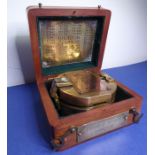 A good and heavy reproduction brass compass with mirrored interior housed within a hardwood box with