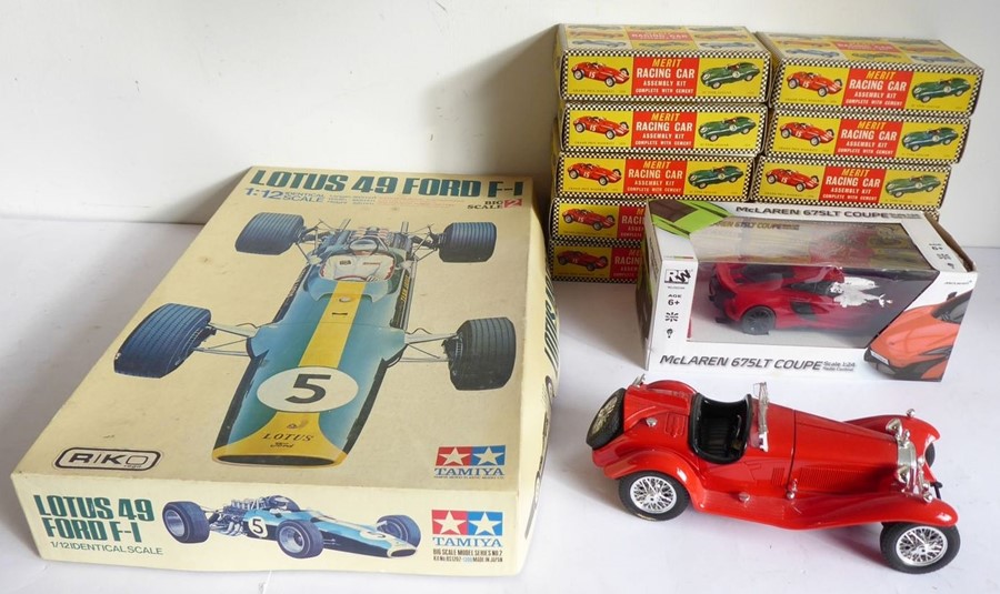 A good quantity of boxed Merit racing car assembly kits together with a Lotus 49 Ford F1 (1:12