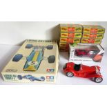 A good quantity of boxed Merit racing car assembly kits together with a Lotus 49 Ford F1 (1:12