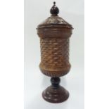 Paul Coker; a late 20th century treen (probably rosewood) cup and cover; carved in earlier style,