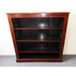 A late 19th/early 20th century mahogany and satinwood cross-banded open bookcase raised on plinth