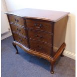 A modern reproduction serpentine-fronted mahogany cabinet in late 18th century-style; the hinged top