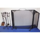 A heavy wrought-iron and wire-mesh fireguard with folding ends, together with a fireside companion