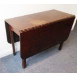 A late 18th century drop-leaf mahogany dining table on square chamfered legs