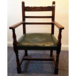 A Titchmarsh & Goodwin oak desk chair upholstered in hide
