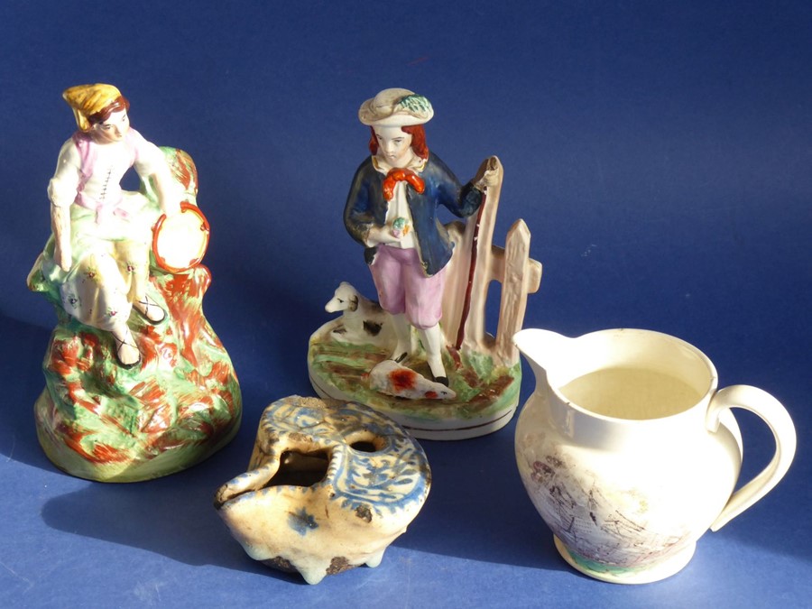 A mixed pottery group of four: two mid-19th century Staffordshire figures, one with a shepherd