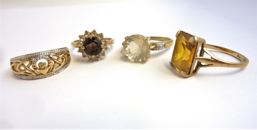 Four 9-carat gold stone-set rings (13.6g) (The cost of UK postage via Royal Mail Special Delivery