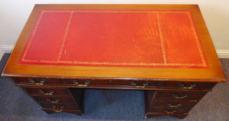 A reproduction mahogany Georgian-style pedestal desk; red-leather-inset top above an arrangement - Image 3 of 6