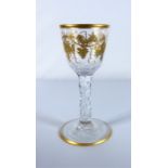 A circa 1780 wine glass with gilt decoration and facet stem (approx. 15cm high)  Condition Report: