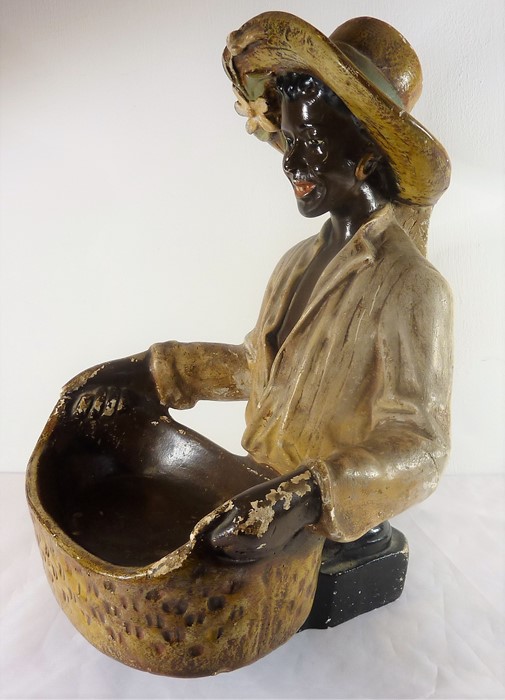 A mid-20th century painted plaster blackamoor-style figure; the smiling figure holds a two-handled - Image 2 of 3