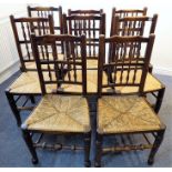 A late 19th century matched harlequin set of eight country-style chairs having turned spindles, rush