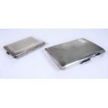 A silver cigarette case with vacant cartouche and another smaller silver case; both with engine-