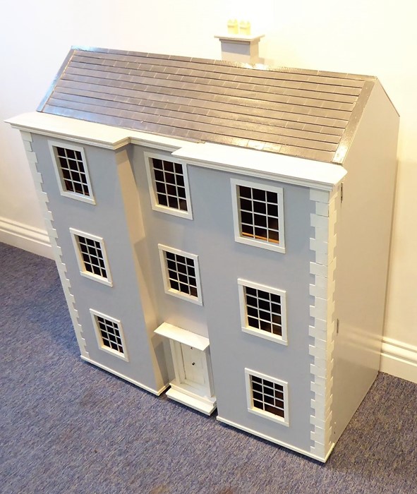 A fine and impressive 1970s scratch-built dolls' house in the Georgian style; double fronted and