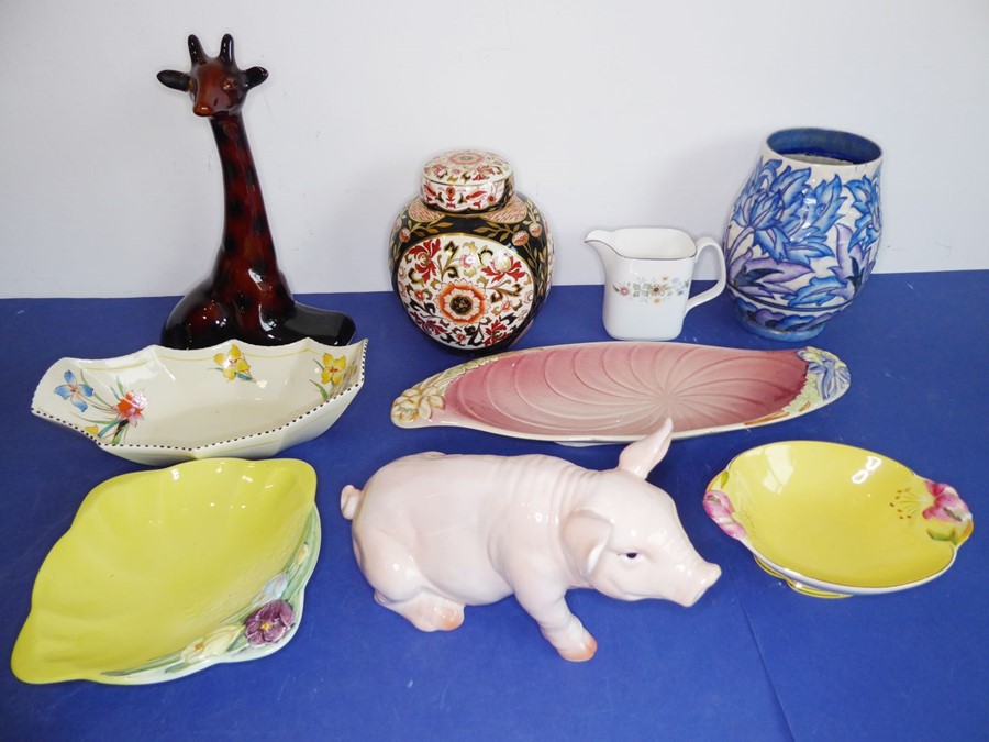 A good selection of pottery and porcelain: a model of a pig and a model of a giraffe (the larger,